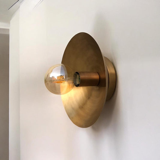 Solid brass wall lamp showcasing natural brass finish