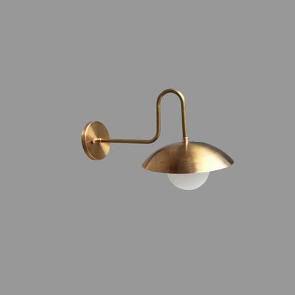 Vintage brass wall light with round white glass shade | Frost Lights