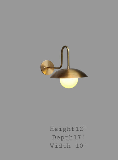 Handmade brass wall lamp with elegant globe shade | Frost Lights