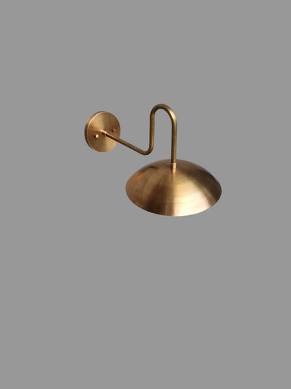 Artisan handcrafted brass wall sconce with curved arm design | Frost Lights
