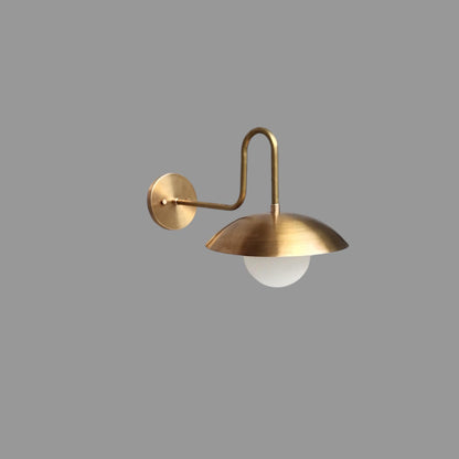 Handmade brass wall sconce with matte white glass globe | Frost Lights