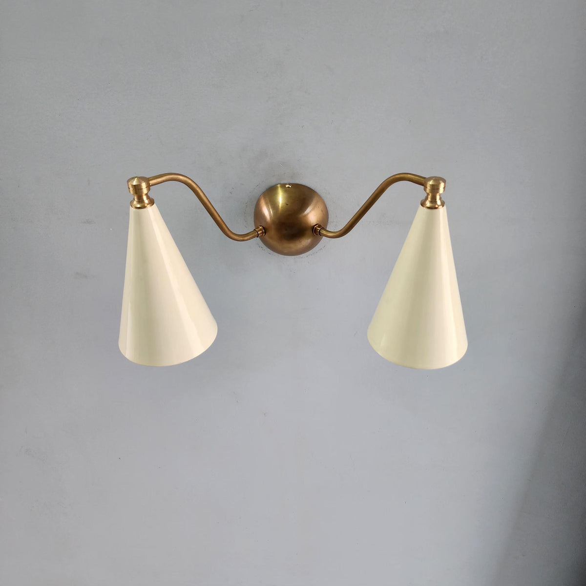 Designer Brass Wall Sconce With Symmetrical Form | Frost Lights