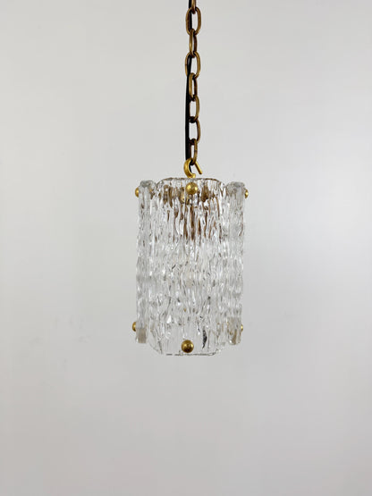 Frost Lights modern textured glass pendant hanging on chain.