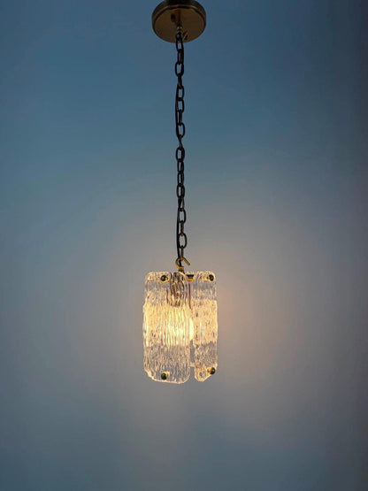 Frost Lights textured glass pendant lamp hanging from chain.