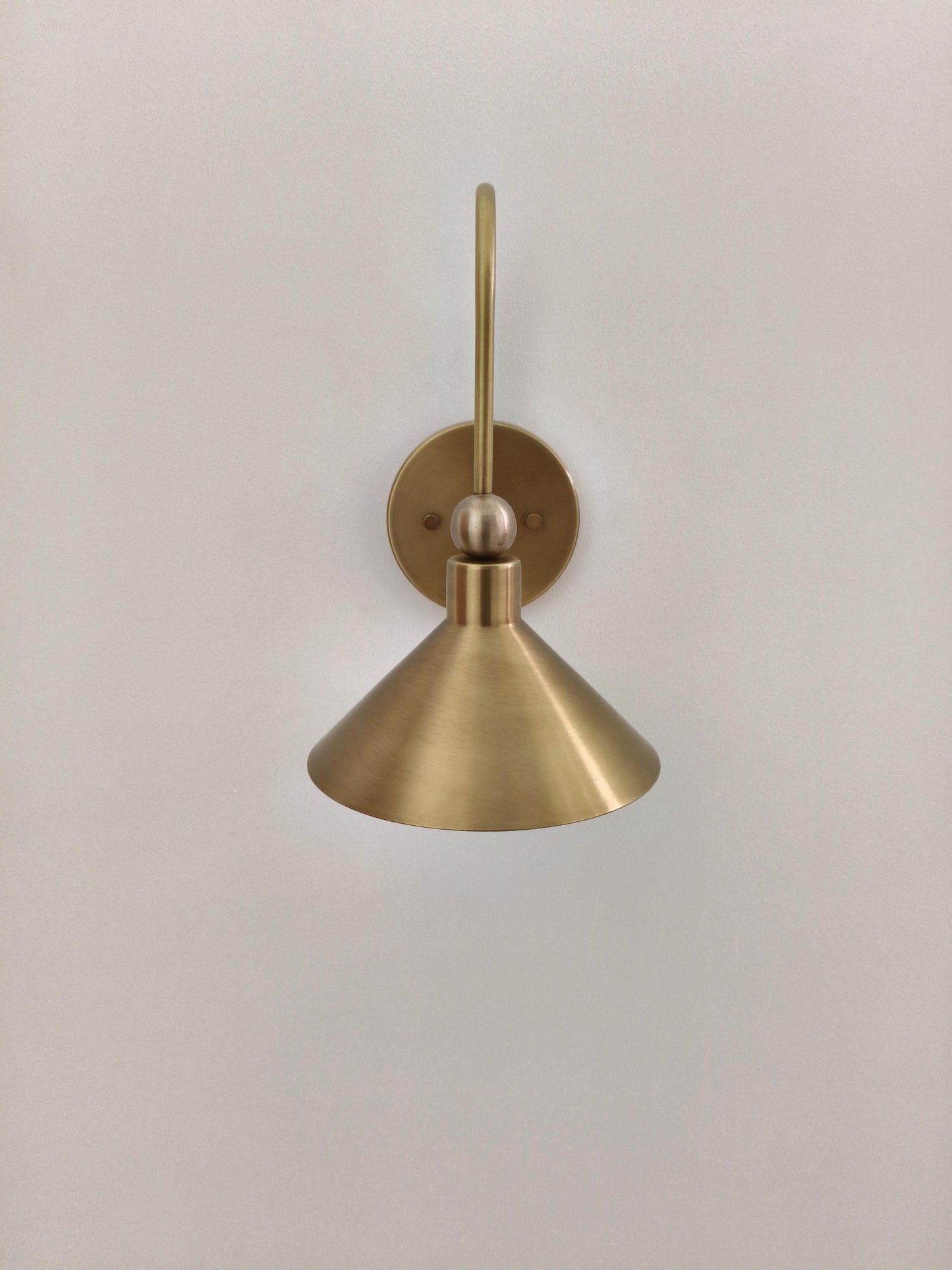 Handcrafted Brass Wall Sconce: Arched Arm Cone Shade - Choice of Finish