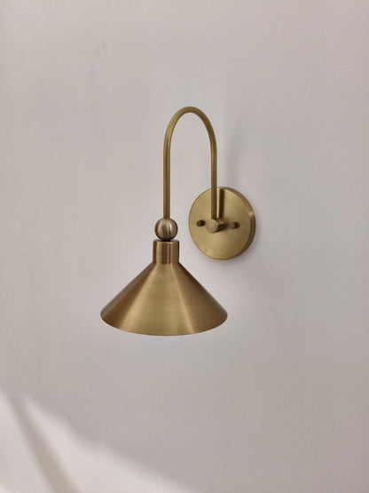 Brass Wall Light With Curved Arm And Cone Shade | Frost Lights