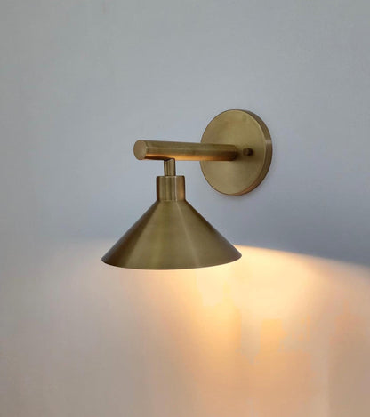 Modern Brass Wall Light With Sleek Cone Shade | Frost Lights