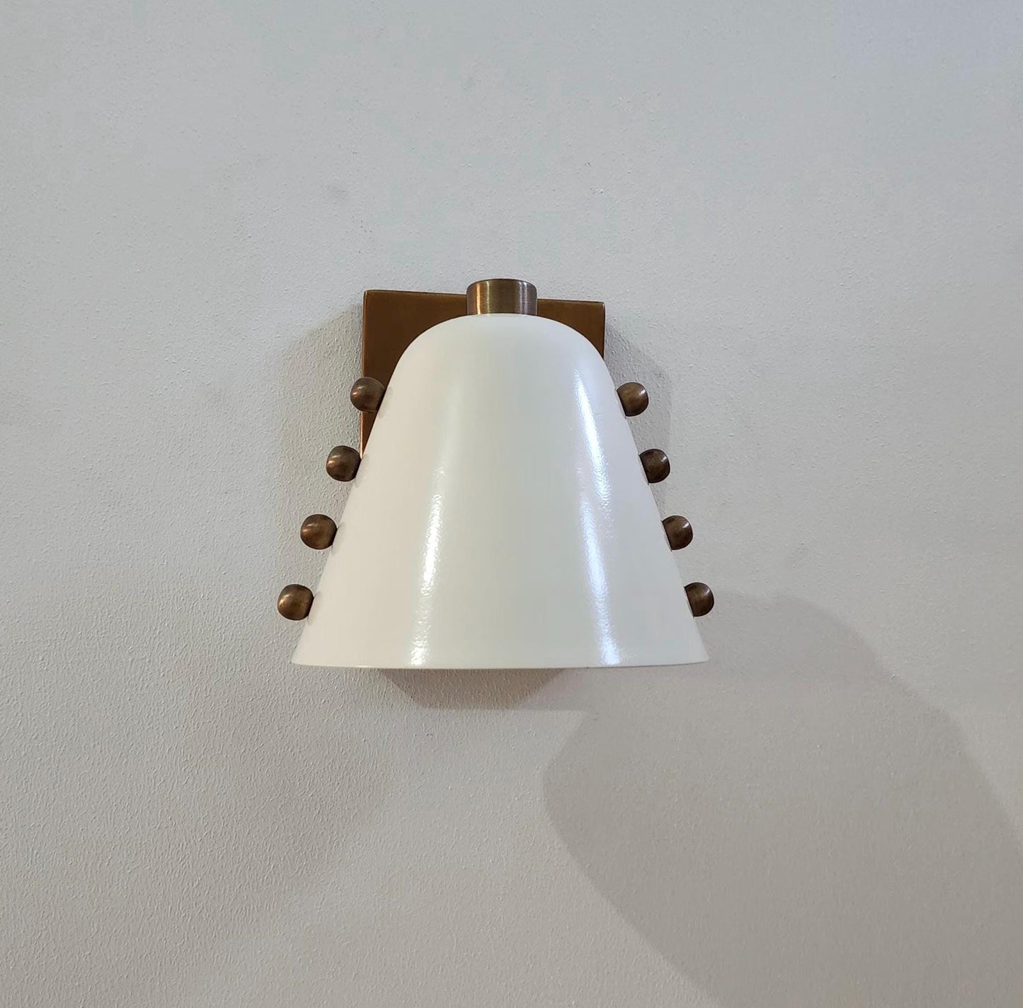Ivory Cone Brass Wall Sconce with Rivet Detailing – Handcrafted Mid-Century Modern Wall Lamp
