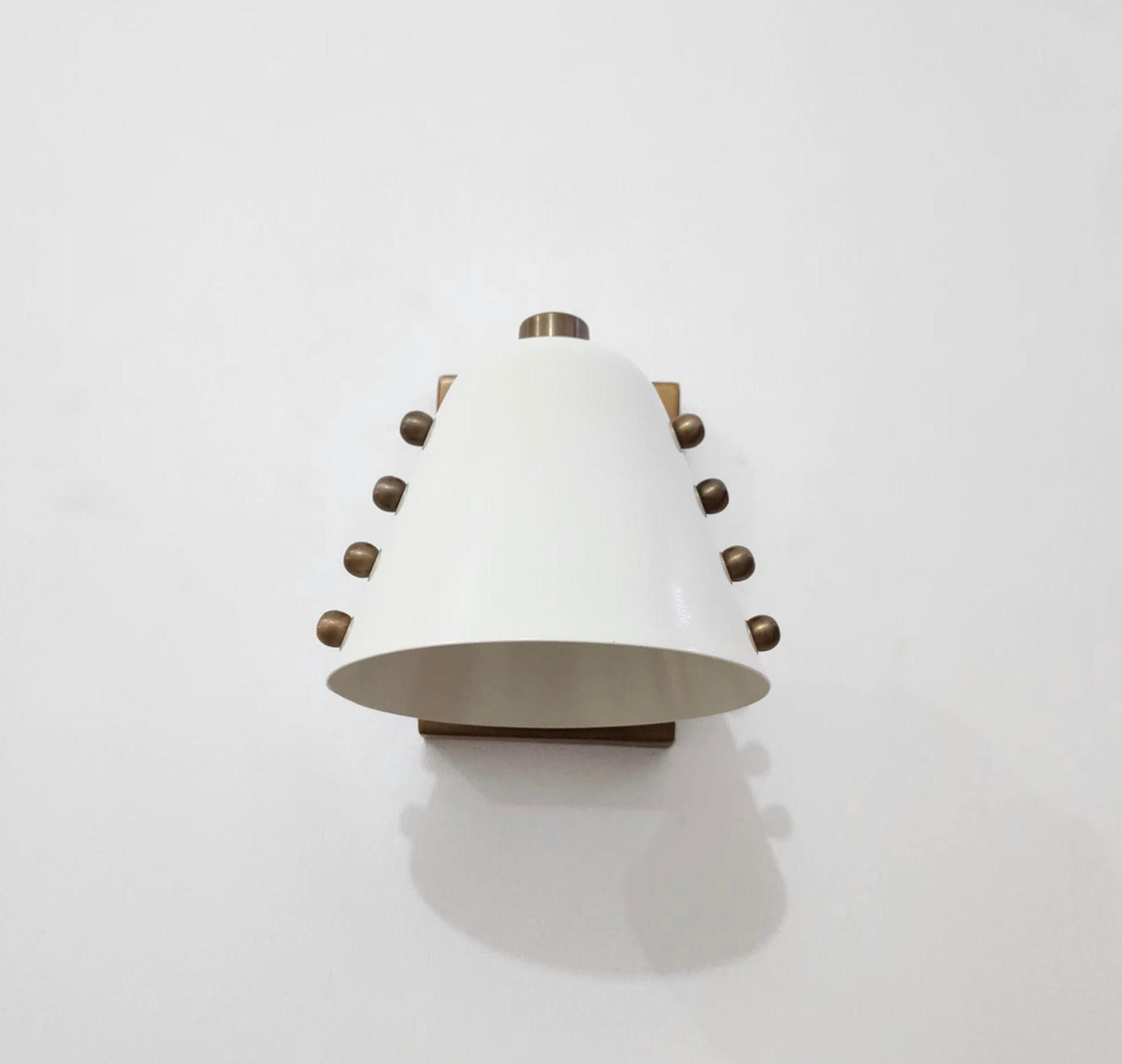 Ivory Cone Brass Wall Sconce with Rivet Detailing – Handcrafted Mid-Century Modern Wall Lamp