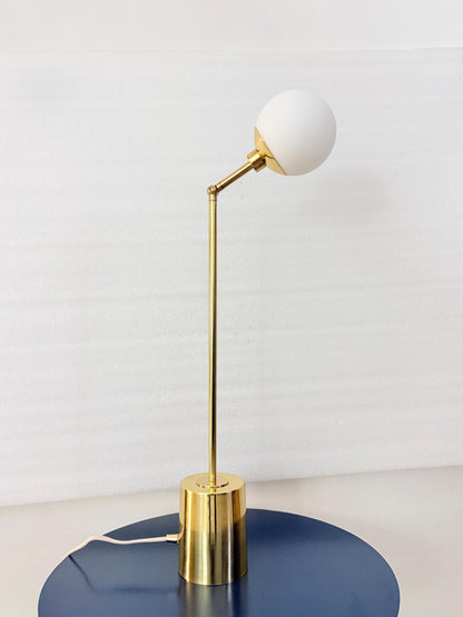 The Articulated Brass Arm of This Table Lamp Supports a Smooth Opal Globe, Creating a Graceful Contrast Between Curved and Linear Forms. a Compact Cylindrical Base Anchors the Design, Making the Fixture Visually Suited to Minimalist Desks and Nightstands, Frost Lights.