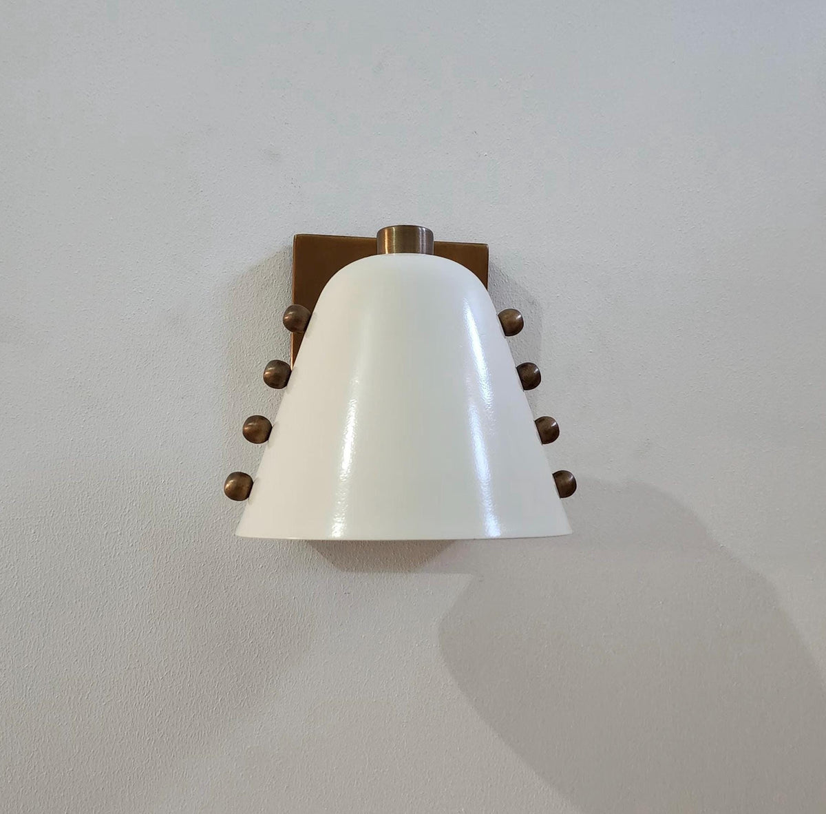 Ivory Cone Brass Wall Sconce with Rivet Detailing – Handcrafted Mid-Century Modern Wall Lamp - optimized image