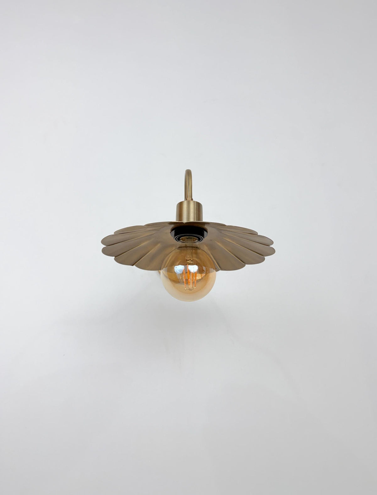 Modern Brass Flower Wall Sconce with Amber Shade | 10" W x 6" H - optimized image