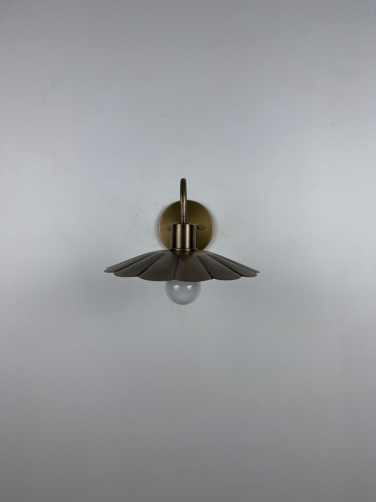 Modern Brass Flower Wall Sconce with Amber Shade | 10" W x 6" H - optimized image