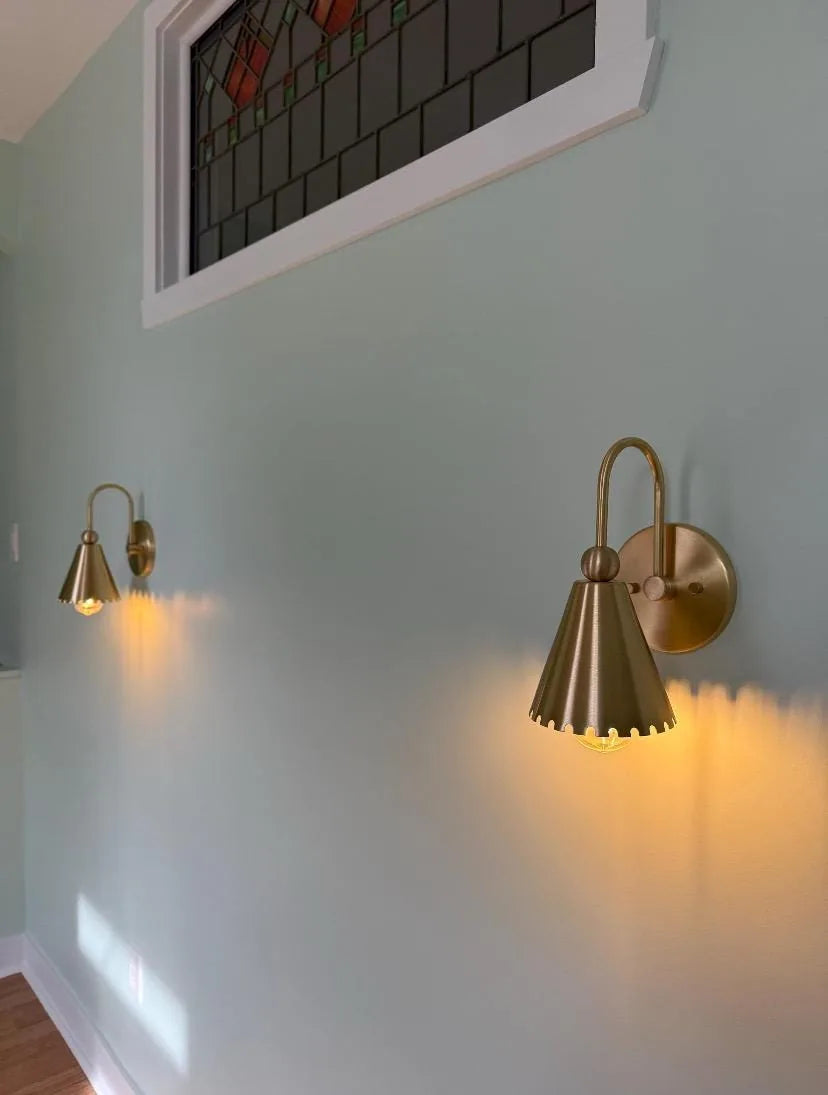 Rustic antique brass sconce designed to enhance your home's decor with warmth and sophistication.