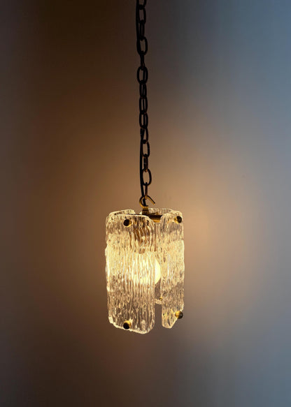 Stylish textured glass pendant ceiling light with brass trim and chain suspension.