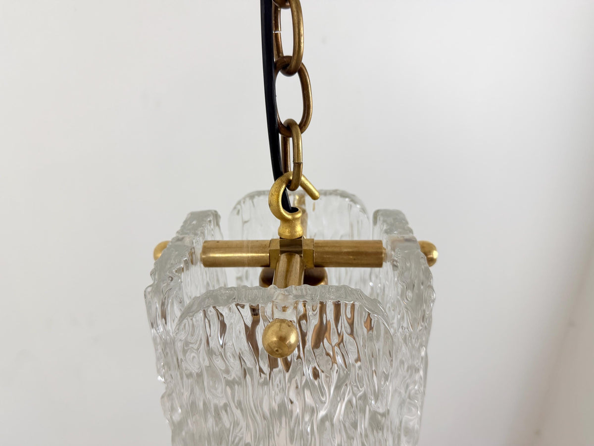 Stylish textured glass pendant ceiling light with brass trim and chain suspension.